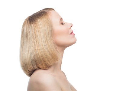 Profile of beautiful middle aged woman with smooth skin and short blond hair. Beauty shot. Isolated over white background. Copy space. Photographie de stock - Aubaine LD & Abonnement, Code: 400-08731481
