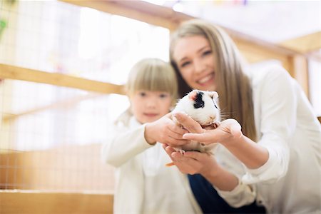 pet shelter - Mother and daughter with pets Stock Photo - Budget Royalty-Free & Subscription, Code: 400-08731727