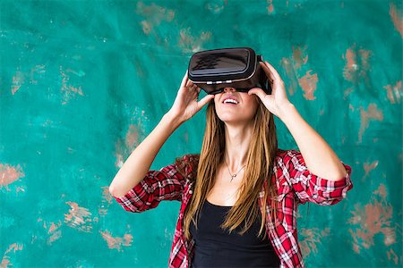 sensor - Woman in virtual reality headset enjoying her experience. Stock Photo - Budget Royalty-Free & Subscription, Code: 400-08731902