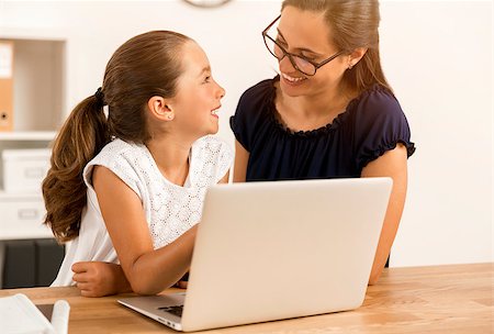 Mother and daugther at home doing homework together Stock Photo - Budget Royalty-Free & Subscription, Code: 400-08733022