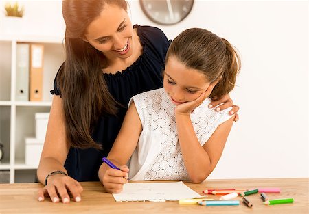Mother helping her little daughter making drawings Stock Photo - Budget Royalty-Free & Subscription, Code: 400-08733035