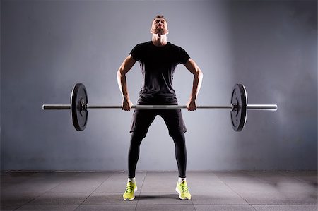 simsearch:400-05268701,k - Crossfit fitness gym heavy weight lifting bar by strong man workout Foto de stock - Super Valor sin royalties y Suscripción, Código: 400-08750840