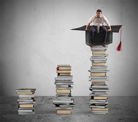 Businessman sitting on a pile of books with graduation cap Stock Photo - Budget Royalty-Free & Subscription, Code: 400-08750888
