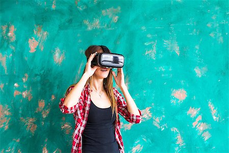 sensor - happy smiling young beautiful girl l getting experience using VR-headset glasses of virtual reality at home much gesticulating hands Stock Photo - Budget Royalty-Free & Subscription, Code: 400-08751151