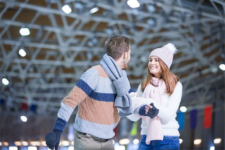 Young couple at skating rink Stock Photo - Budget Royalty-Free & Subscription, Code: 400-08770550