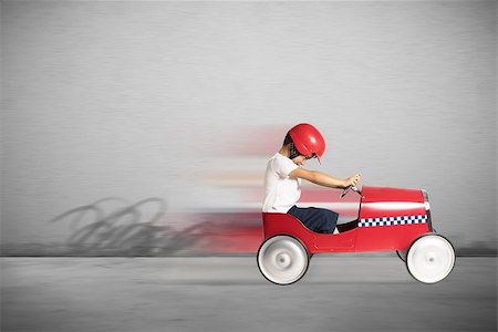 Boy child play and runs with toy car Stock Photo - Budget Royalty-Free & Subscription, Code: 400-08770905