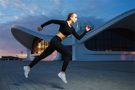 Concept: healthy lifestyle, sport. Attractive happy girl fitness trainer run outdoor workout at modern downtown urban area during sunset. Stock Photo - Budget Royalty-Free & Subscription, Code: 400-08771915