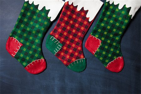 Colored Christmas stocking on a blackboard background Stock Photo - Budget Royalty-Free & Subscription, Code: 400-08796867