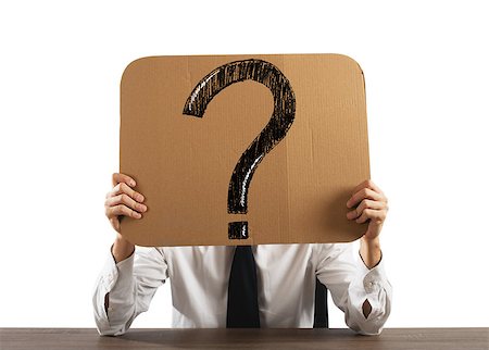 query - Businessman in the office holds a cardboard with big question mark Stock Photo - Budget Royalty-Free & Subscription, Code: 400-08806608