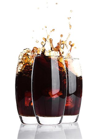 pouring coke into bottle - Glasses of cola with splash and ice cubes on white background Stock Photo - Budget Royalty-Free & Subscription, Code: 400-08815480