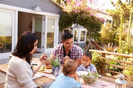 Family Saying Grace Before Outdoor Meal In Garden Stock Photo - Budget Royalty-Free & Subscription, Code: 400-08838130