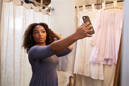 female native american clothing - Woman taking selfie in a boutique changing room Stock Photo - Budget Royalty-Free & Subscription, Code: 400-08839069