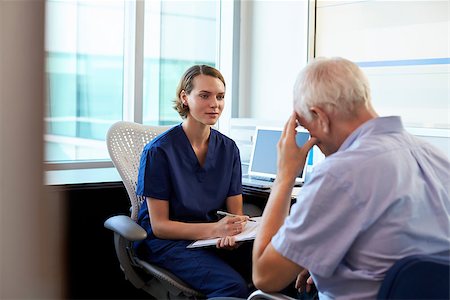 distressed female physician - Doctor In Consultation With Depressed Male Patient Stock Photo - Budget Royalty-Free & Subscription, Code: 400-08839412