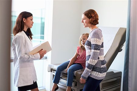 pediatrician latin hispanic - Pediatrician Meeting With Mother And Child In Exam Room Stock Photo - Budget Royalty-Free & Subscription, Code: 400-08839475