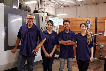 Portrait Of Engineer Training Apprentices On CNC Machine Stock Photo - Budget Royalty-Free & Subscription, Code: 400-08839521
