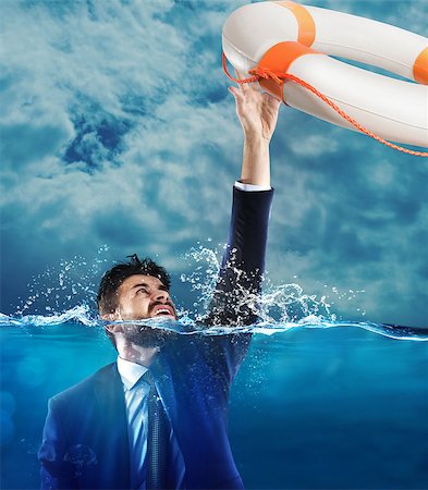 drown - Lifesaver launched a drowning man in the sea Stock Photo - Budget Royalty-Free & Subscription, Code: 400-08831357