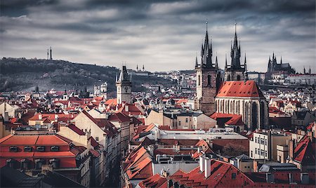 simsearch:400-07771401,k - High spires towers of Tyn church in Prague city (Church of Our Lady before Tyn cathedral) urban landscape panorama with red roofs of houses in old town and blue sky with clouds Photographie de stock - Aubaine LD & Abonnement, Code: 400-08863282