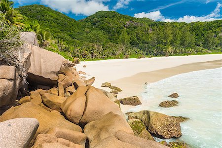 simsearch:400-05745636,k - Beautiful and a famous beach Anse Petite seen from the granite boulders, La Digue island, Seychelles. Stock Photo - Budget Royalty-Free & Subscription, Code: 400-08887687