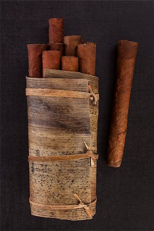 simsearch:400-05207678,k - Traditional cuban cigars on black stone background, top view. Stock Photo - Budget Royalty-Free & Subscription, Code: 400-08888164