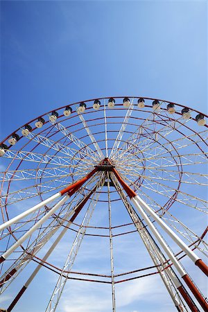 simsearch:400-08403714,k - Ferris wheel and blue sky in sun day. Wide angle view. Stock Photo - Budget Royalty-Free & Subscription, Code: 400-08888361
