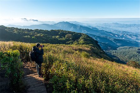 simsearch:400-04636750,k - Man with camera shoot viwe at  kew mae parn viewpoint.Doi Inthanon Chiang Mai in Thailand Stock Photo - Budget Royalty-Free & Subscription, Code: 400-08888431