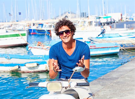 Young Italian Man on Vespa Gesturing Stock Photo - Budget Royalty-Free & Subscription, Code: 400-08889238