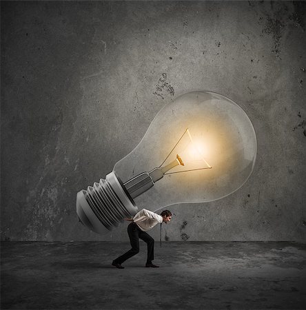 Businessman holds a big light bulb. Have a great idea to be realized concept Stock Photo - Budget Royalty-Free & Subscription, Code: 400-08899307