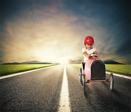 funny images of people driving - Child with a toy car drives on a country road Stock Photo - Budget Royalty-Free & Subscription, Code: 400-08899845