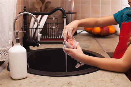 simsearch:400-04287497,k - Washing the dishes - child hands cleaning a glass with sponge and foamy detergent at the kitchen sink, shallow depth Stock Photo - Budget Royalty-Free & Subscription, Code: 400-08890864
