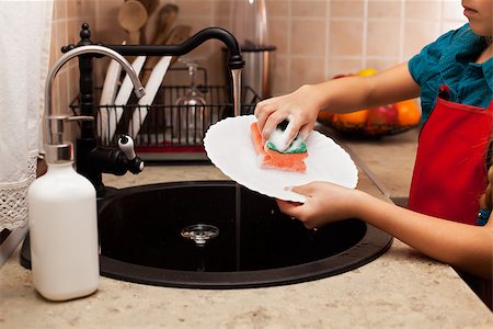 simsearch:400-04287497,k - Child washing a plate with sponge at the kitchen sink - closeup, shallow depth Stock Photo - Budget Royalty-Free & Subscription, Code: 400-08890863