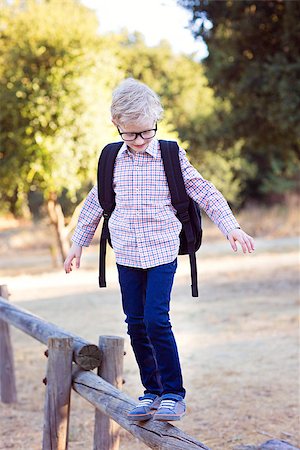 simsearch:695-03381153,k - cute school boy student in glasses and with backpack enjoying time outdoor, back to school concept Stock Photo - Budget Royalty-Free & Subscription, Code: 400-08891199