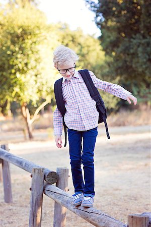 simsearch:695-03381153,k - cute school boy student in glasses and with backpack enjoying time outdoor, back to school concept Stock Photo - Budget Royalty-Free & Subscription, Code: 400-08891193
