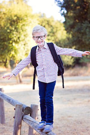 simsearch:695-03381153,k - cute school boy student in glasses and with backpack enjoying time outdoor, back to school concept Stock Photo - Budget Royalty-Free & Subscription, Code: 400-08891215