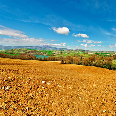 simsearch:400-05711931,k - Mountain Lake Surrounded by Forests and Plowed Fields Stock Photo - Budget Royalty-Free & Subscription, Code: 400-08891402