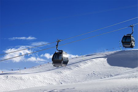 simsearch:400-04636750,k - Gondola lifts on ski resort at sun wind day. Greater Caucasus, Mount Shahdagh, Azerbaijan. Stock Photo - Budget Royalty-Free & Subscription, Code: 400-08892761