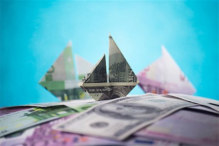 ship origami banknotes on a background of money Stock Photo - Budget Royalty-Free & Subscription, Code: 400-08997028