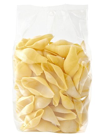 environmental impact - close up of raw uncooked italian conchiglie jumbo shell pasta in plastic bag isolated Stock Photo - Budget Royalty-Free & Subscription, Code: 400-08997115