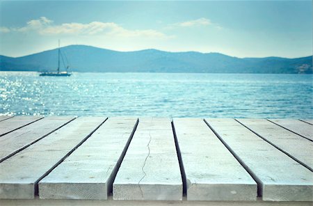 Holiday background. Wooden planks with sea. Ocean with table Stock Photo - Budget Royalty-Free & Subscription, Code: 400-09028793