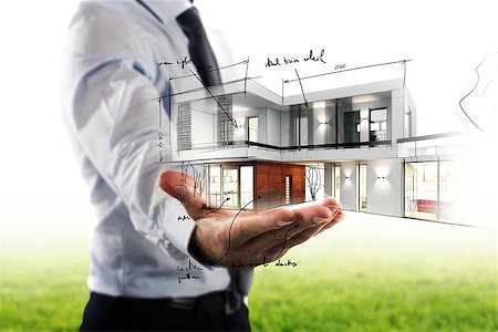 simsearch:400-06424061,k - Businessman showing a modern office project in hand Stock Photo - Budget Royalty-Free & Subscription, Code: 400-09029658