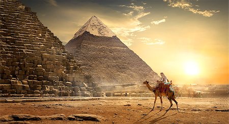 simsearch:400-05098768,k - Nomad on camel near pyramids in egyptian desert Stock Photo - Budget Royalty-Free & Subscription, Code: 400-09029805