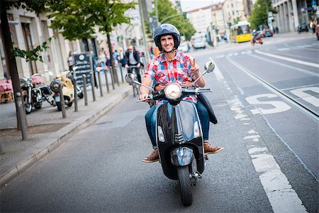 Young scooter driver in the streets of Berlin Mitte Stock Photo - Budget Royalty-Free & Subscription, Code: 400-09064656