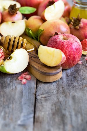 simsearch:400-06069331,k - Apples, pomegranate and honey - symbols of judaic holiday Rosh Hashana (Jewish New Year). Selective focus. Copyspace background. Stock Photo - Budget Royalty-Free & Subscription, Code: 400-09080024