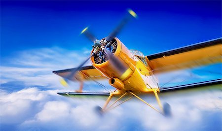 simsearch:400-08188604,k - biplane breaks through the clouds Stock Photo - Budget Royalty-Free & Subscription, Code: 400-09082181