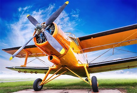 simsearch:400-04996557,k - biplane against a claudy sky Stock Photo - Budget Royalty-Free & Subscription, Code: 400-09082425