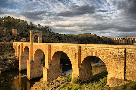 simsearch:400-04587823,k - Roman bridge of Alcantara. Dates from de II century B.C. It was very important over the history as a strategic point to cross the Tagus river during Roman domination period in Spain. Caceres, Extremadura Stock Photo - Budget Royalty-Free & Subscription, Code: 400-09083287