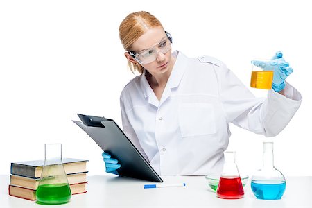 simsearch:400-09011632,k - Pretty young chemist makes tests of substances in test tubes, portrait is isolated Stock Photo - Budget Royalty-Free & Subscription, Code: 400-09083288