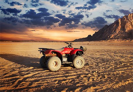 dune driving - Quad bike in sand desert near mountain Stock Photo - Budget Royalty-Free & Subscription, Code: 400-09115132