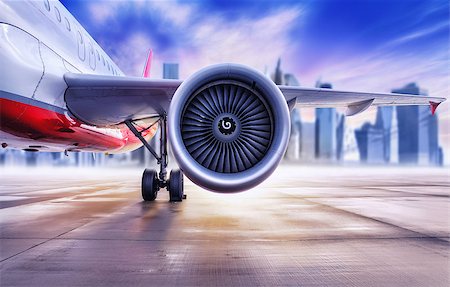 airplane in front of a big city skyline Stock Photo - Budget Royalty-Free & Subscription, Code: 400-09119863