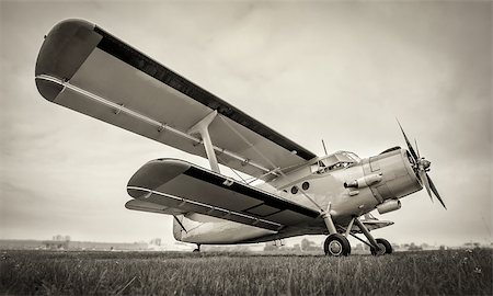 simsearch:400-08188604,k - sports plane on a meadow against a cloudy sky Stock Photo - Budget Royalty-Free & Subscription, Code: 400-09119974