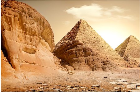 simsearch:400-04652920,k - Pyramid in sand dust under yellow clouds Photographie de stock - Aubaine LD & Abonnement, Code: 400-09112548